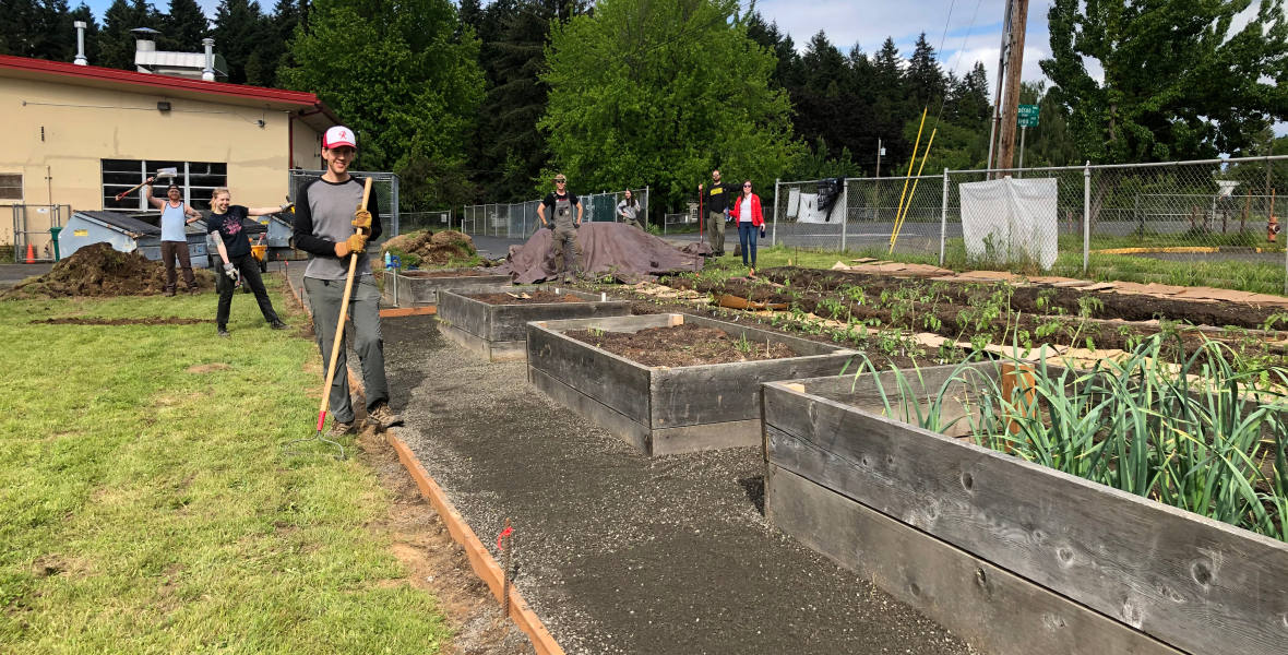 Volunteers celebrating progress at the Sitton Elementary farm plots