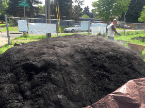 Sitton Elementary compost being moved onto raised beds and ground beds